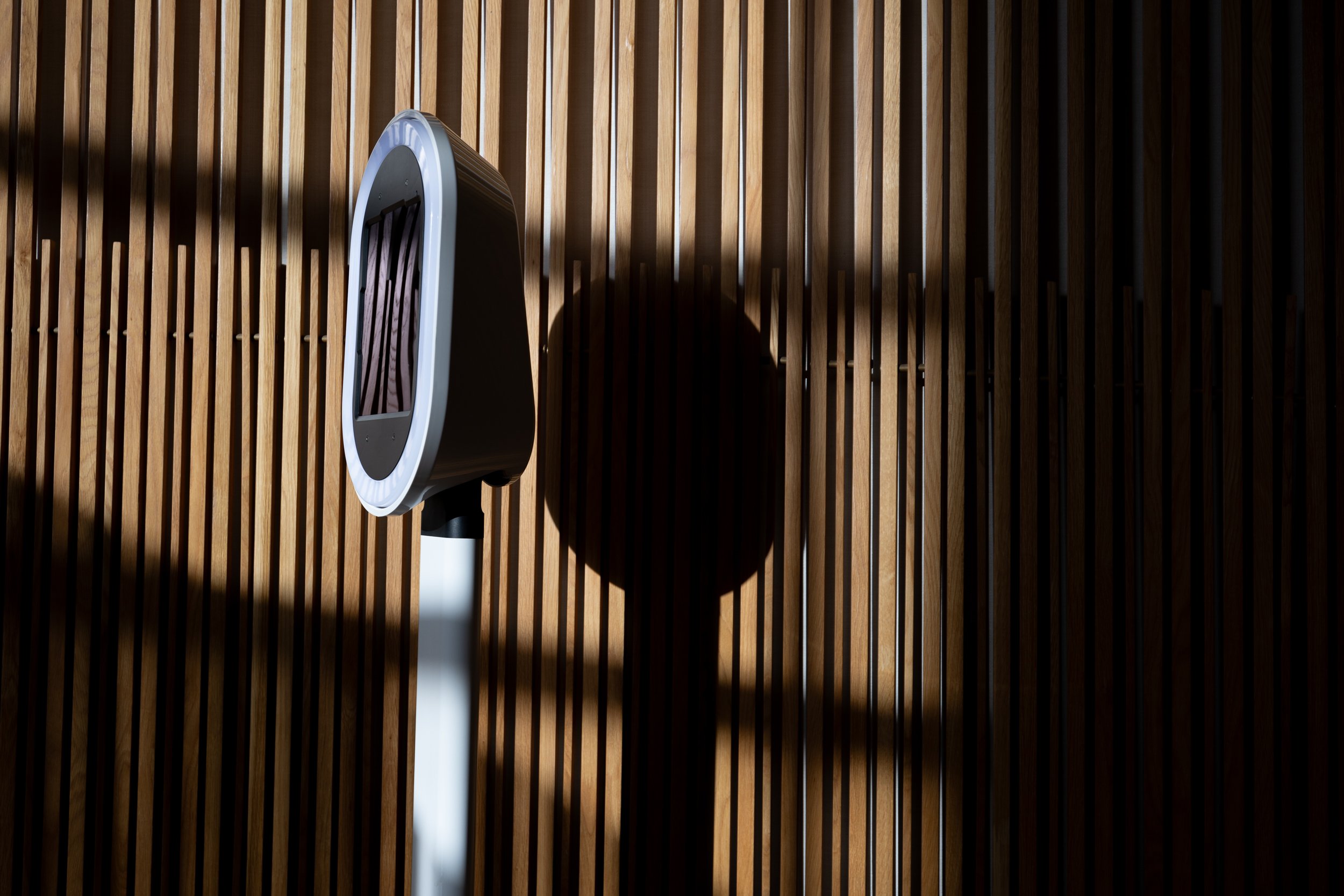 The photo booth standing ready against a slatted wood wall